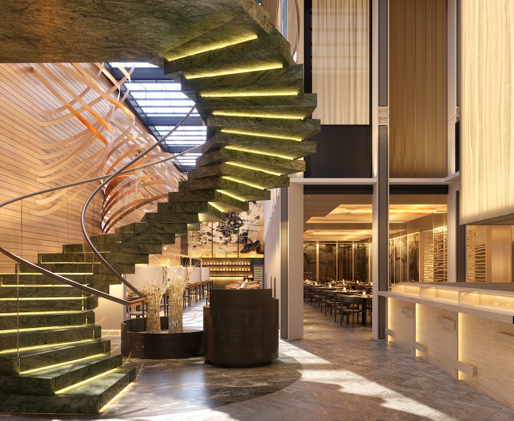 A green spiral staircase in a hotel