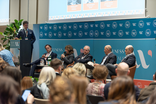 speakers on stage at Wellness Hospitality Conference